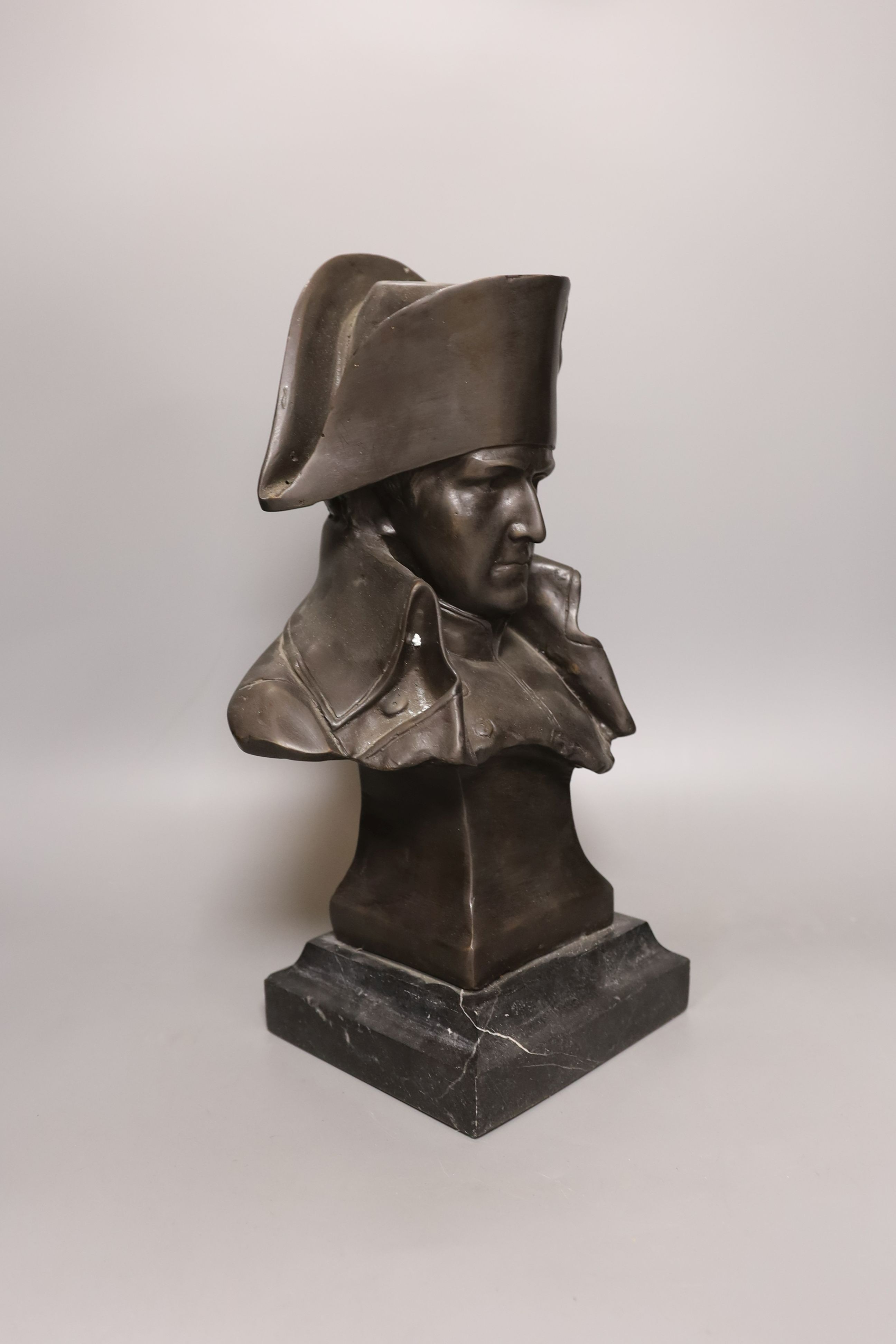 A bronze portrait bust of Napoleon, bearing script mark verso Lecomte 82, on marble plinth, 36cm